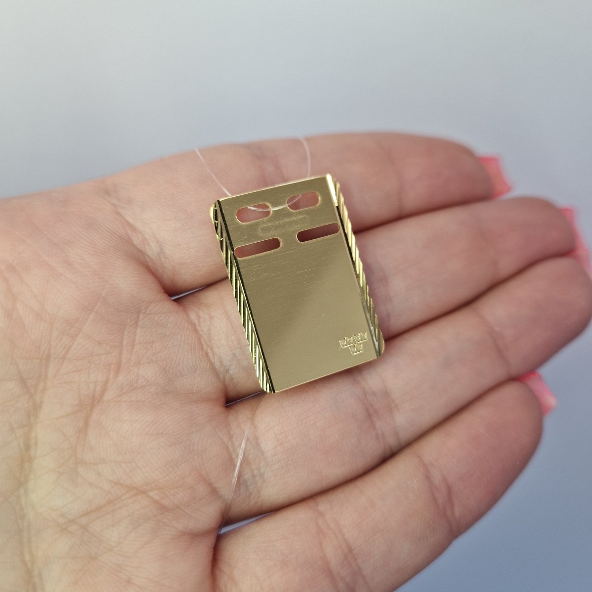 Id-bricka i förgyllt silver