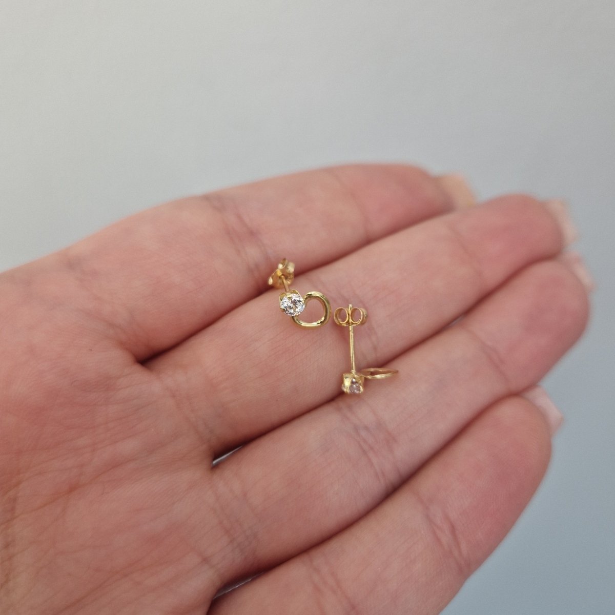 Örhängen 18k guld med kristall och ett guld hjärta