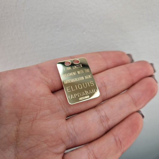 Eliquisbricka i 18k guld