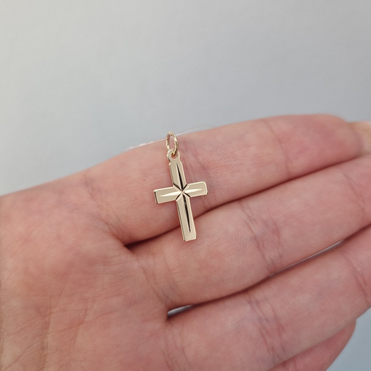 Guld kors facetterad 19x11mm