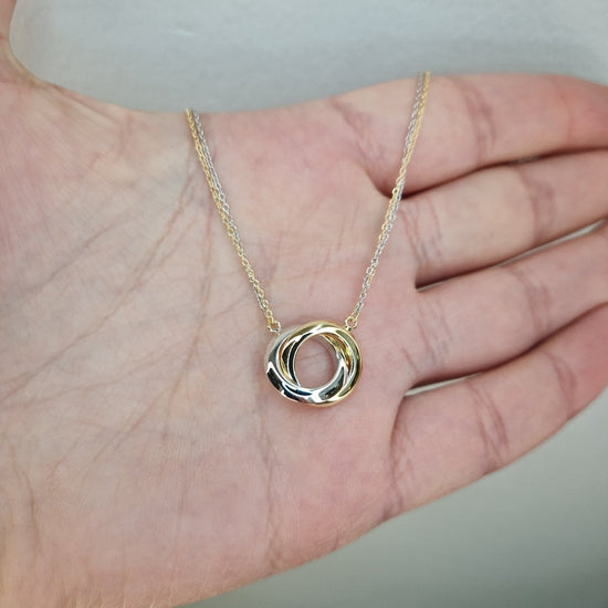 Halsband med cirklar i tvåfärgat 18k guld