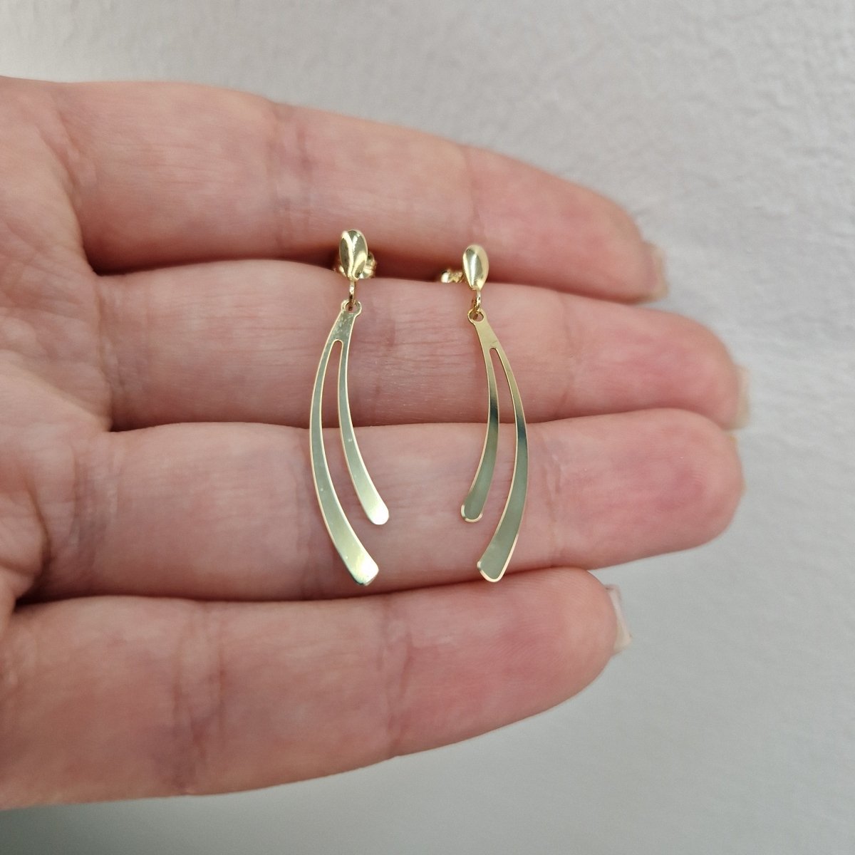 Hängande örhängen i 18k guld