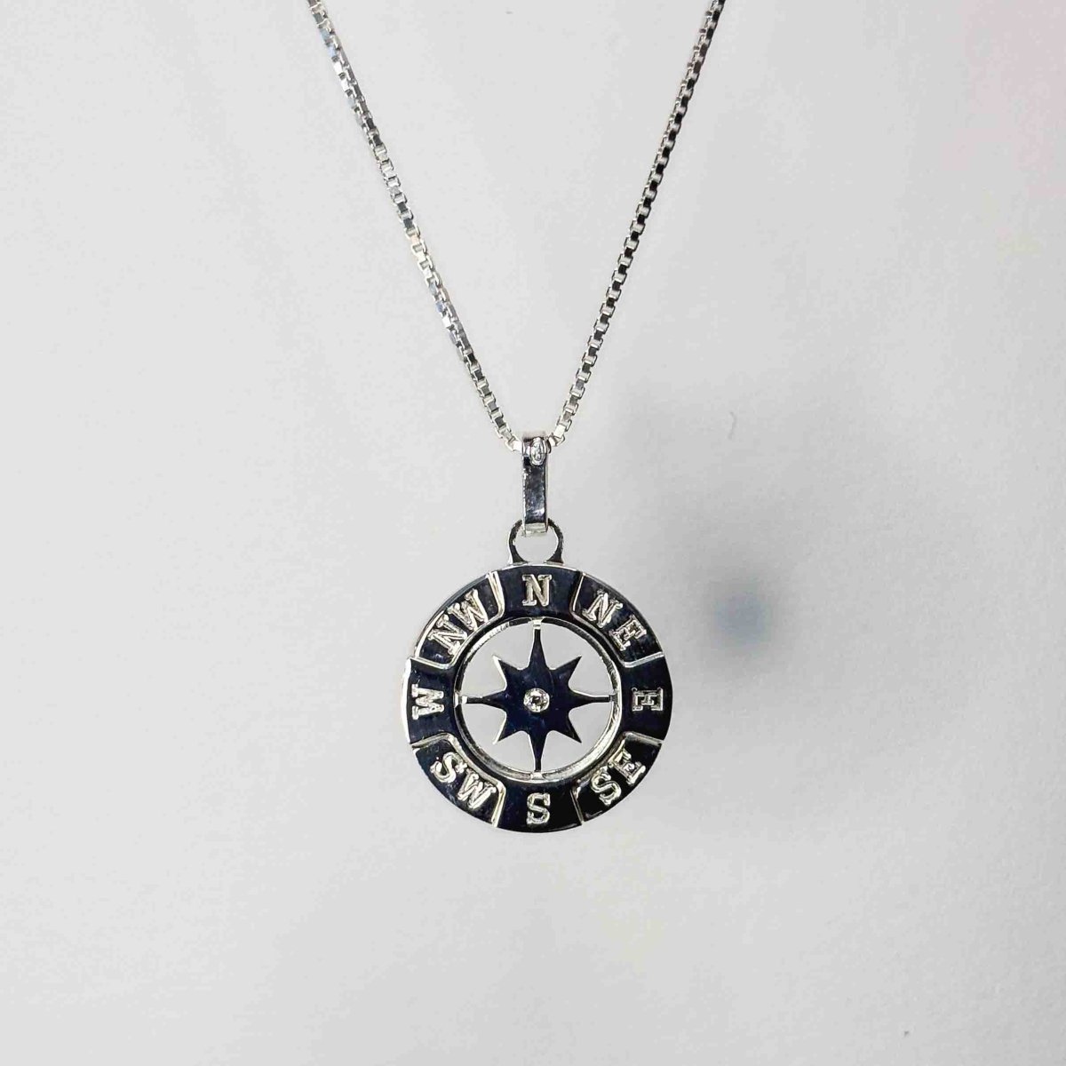 Hänge kompass med sten