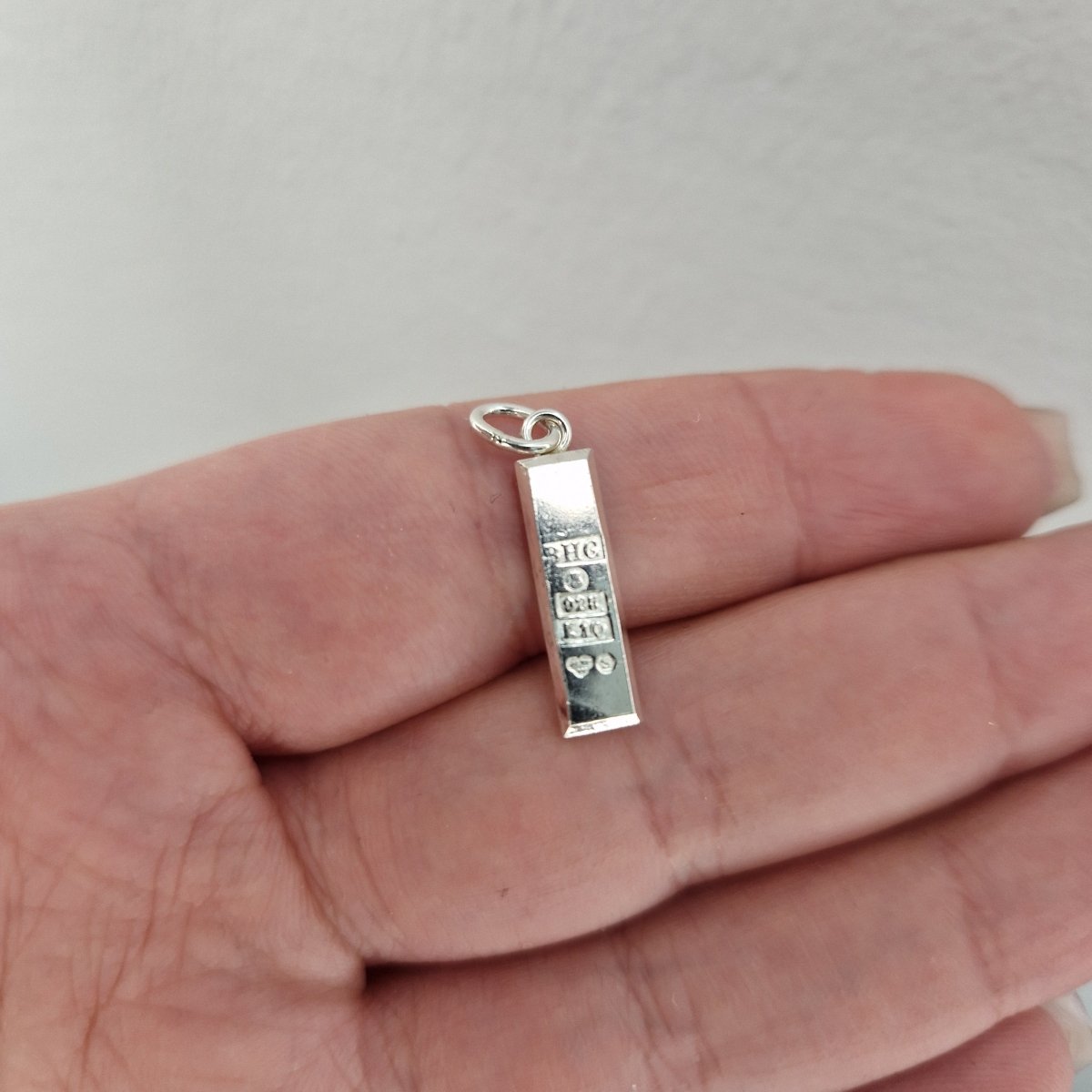 Silvertacka hängsmycke