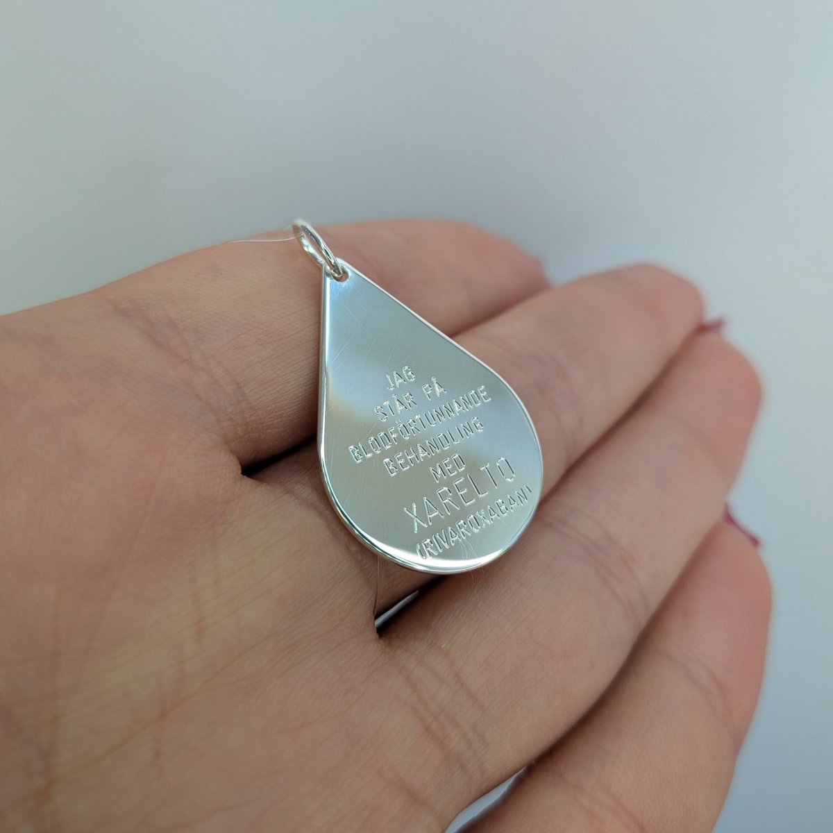 Xarelto bricka silver 27x19mm